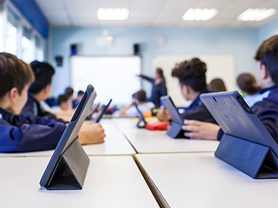 group of kids on tablets