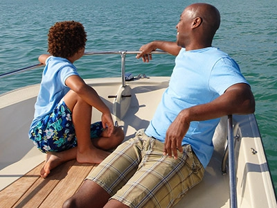 Father and Son on a boat in the water