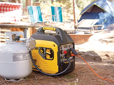 Champion Generator attached to propane at a campsite