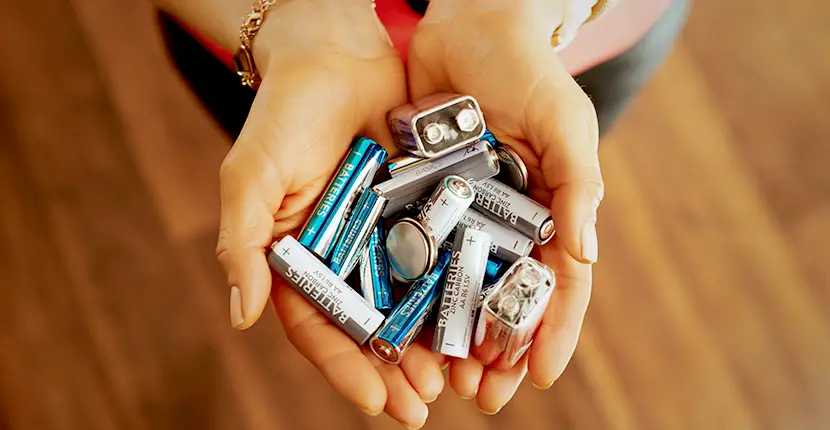 Holding a handful of batteries