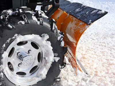 plowing snow with an ATV