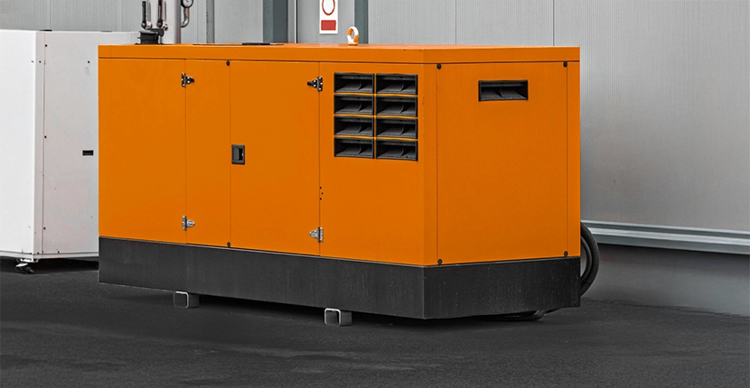 Large orange generator in a warehouse